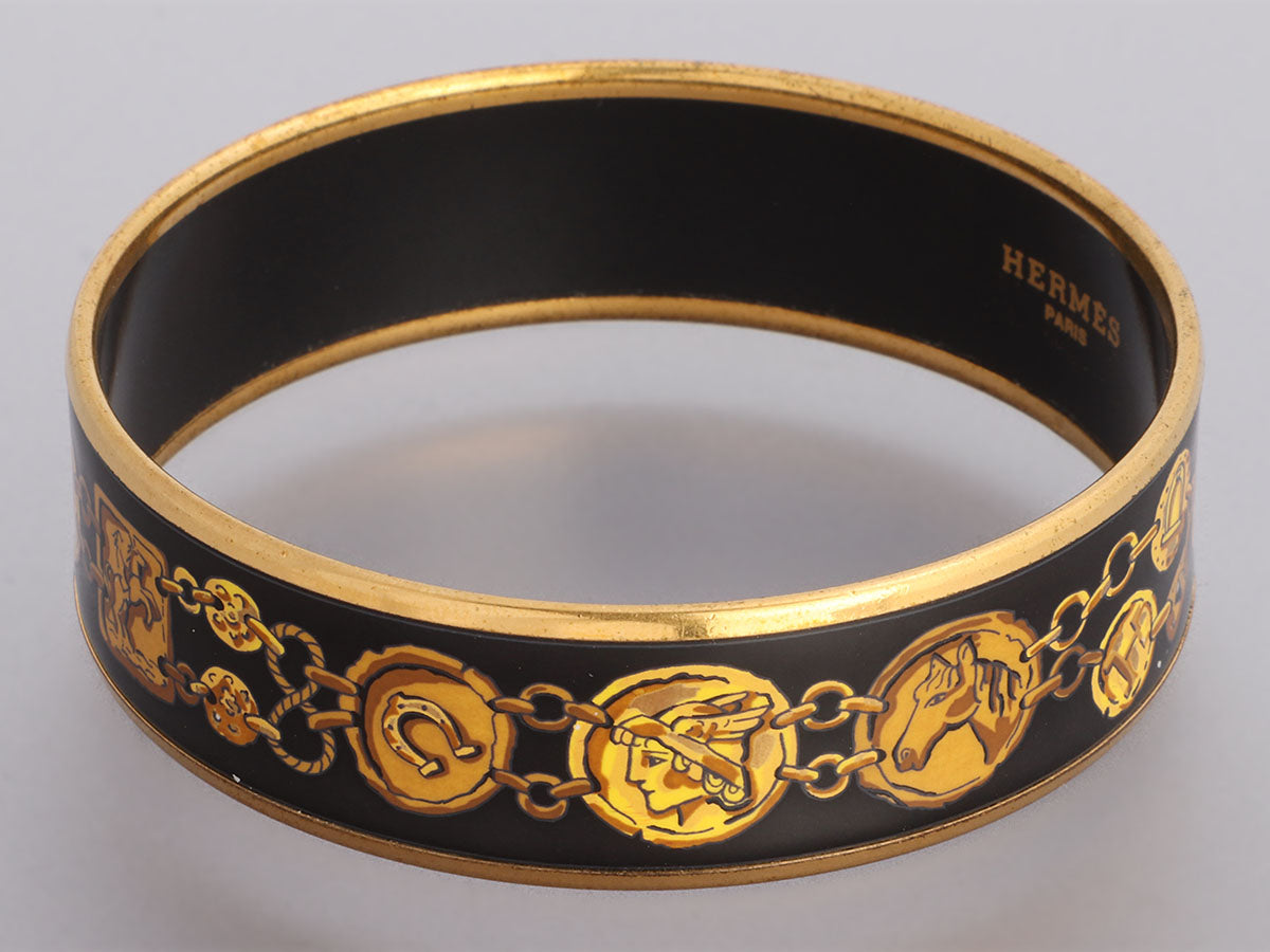 Pre-Loved Hermes Enamel Bangle in Gold/Black Anchor Moti… | Drouot.com