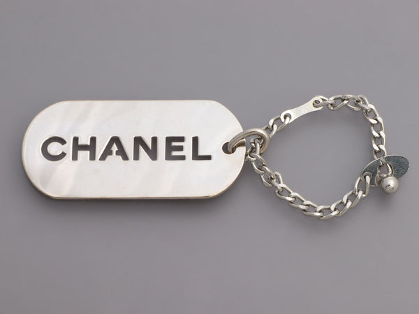 Chanel Silver Tag Keychain Charm · INTO