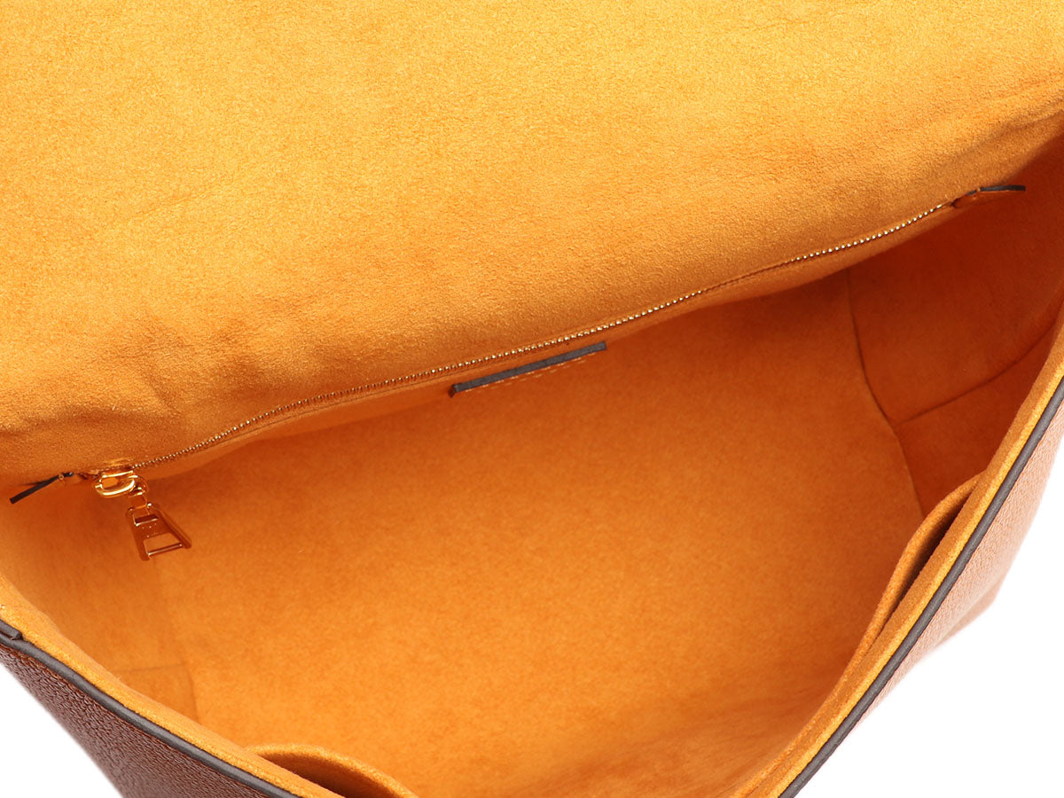 Louis Vuitton Debuts New Packaging in Saffron Shade – WWD